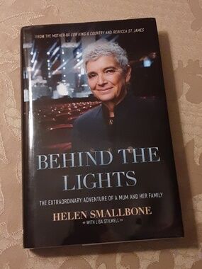 BEHIND THE LIGHTS Hardcover Book